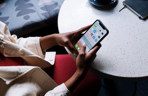 Person typing on a mobile phone