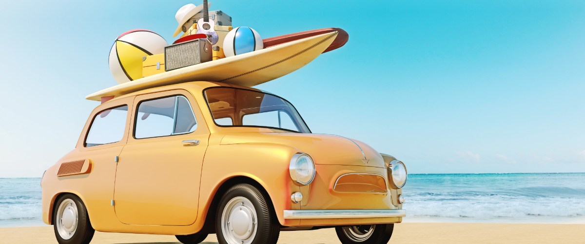 yellow car with surfboard